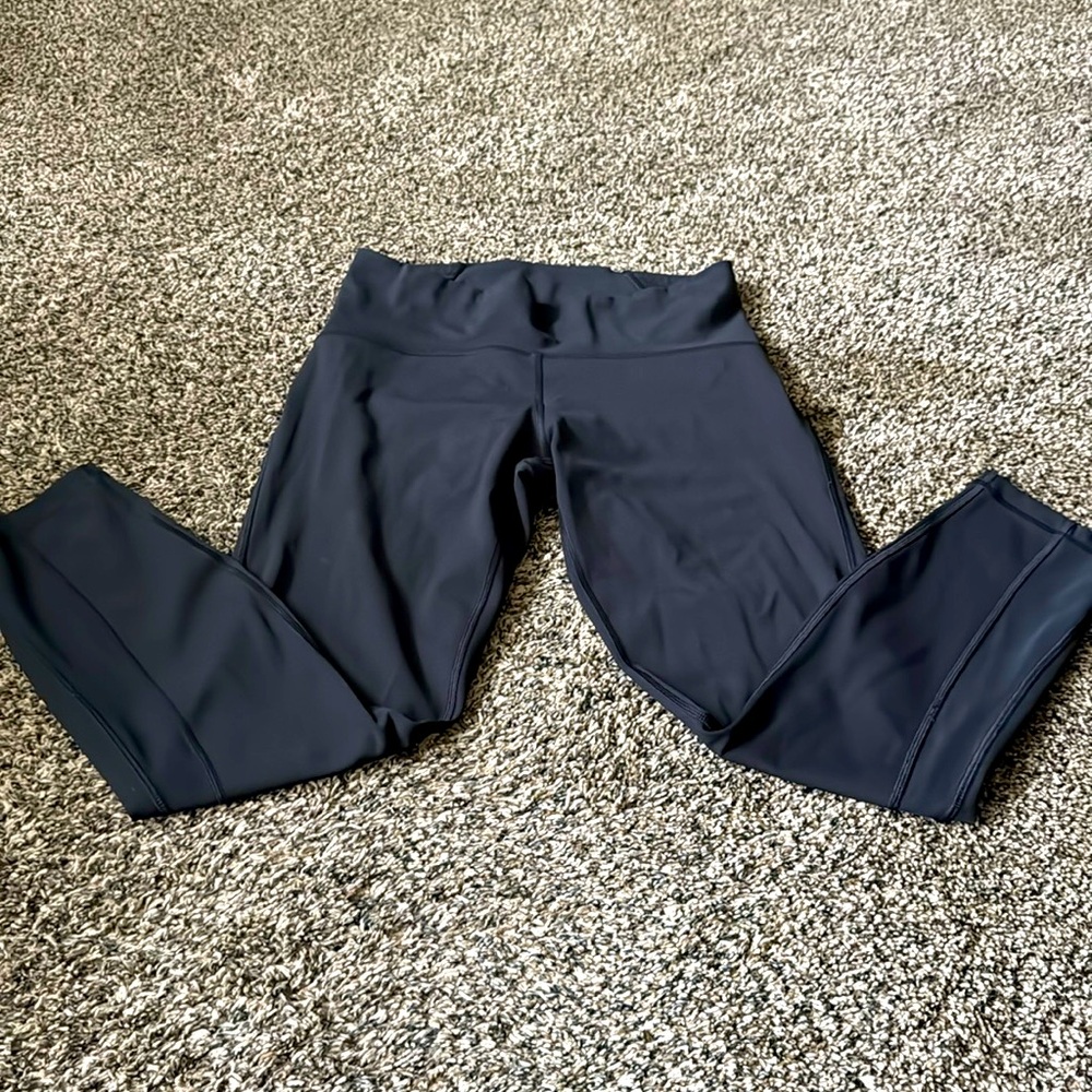 Lululemon Leggings Black Mesh Leg Design 24 inch inseam. Great condition. Size 8